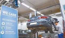  ?? Courtesy of Volkswagen Korea ?? A Volkswagen Korea mechanic tunes up a vehicle at the carmaker’s official service center under its customer service campaign.