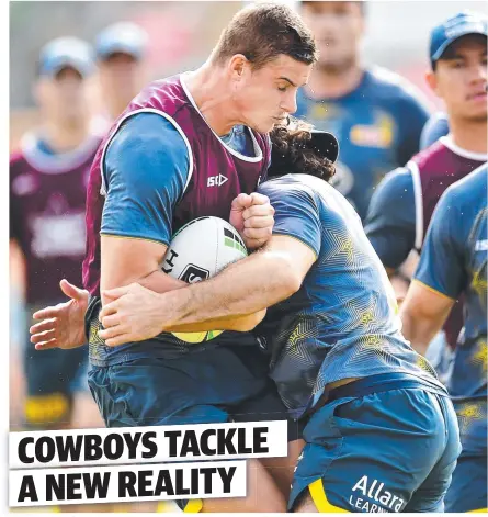 ?? Picture: ALIX SWEENEY ?? OUCH: Cowboys forward Mitch Dunn is hit in a tackle by Jake Granville during a training session earlier this year before the COVID-19 shutdown came into effect.