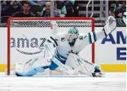  ?? John Froschauer/Associated Press ?? Sharks goaltender Devin Cooley stopped 49 of the Kraken’s 50 shots in a 3-1 win for San Jose.