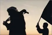  ?? Sundance Institute ?? FIGHTERS in silhouette in “City of Ghosts,” which includes scenes in village overtaken by Islamic State.