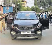  ?? WASEEM ANDRABI/HT PHOTO ?? Police inspect the damaged car of journalist Shujaat Bukhari, who was shot dead by unidentifi­ed gunmen outside his office at Press Colony in Srinagar on Thursday.