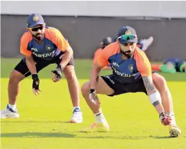  ??  ?? Ajinkya Rahane (left) and Virat Kohli take part in a Team India training session