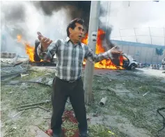  ?? (Omar Sobhani/Reuters) ?? AN AFGHAN man reacts at the site of a blast in Kabul, Afghanista­n yesterday.