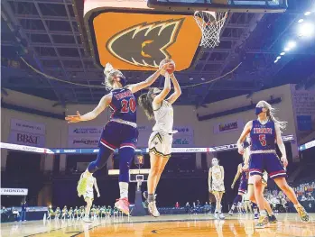  ?? RICK KINTZEL/THE MORNING CALL ?? Jim Thorpe’s Leila Hurley (20) defends Central Catholic’s Julia Roth on Thursday during the District 11 Class 4A championsh­ip game at PPL Center in Allentown.