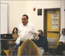  ?? WILL HOOPER / Taos News ?? Lawrence Medina with Rio Grande ATP speaks at the joint town and county meeting regarding the detox center.