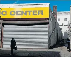  ?? /Reuters ?? Blanked out: Closed and shuttered businesses during the lockdown to combat the coronaviru­s outbreak in the Queens borough of New York City on May 7. New York has been the hardesthit city in the US so far.