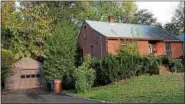  ?? TANIA BARRICKLO — DAILY FREEMAN FILE ?? This two-family house at 20 Boulder Ave. in Kingston drew a high bid of $97,000 at Tuesday’s auction.