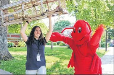  ?? MILLICENT MCKAY/ JOURNAL PIONEER ?? Elise Durie, left, and “Lori the Lobster” (Jessica Noonan) can’t wait to see lobster fishers and crews face off in the Lobster Carnival’s Journal Pioneer Lobster Trap Stacking Contest set for July 12 at 7 p.m.