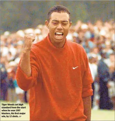  ?? AP ?? Tiger Woods set high standard from the start when he won 1997 Masters, his first major win, by 12 shots.