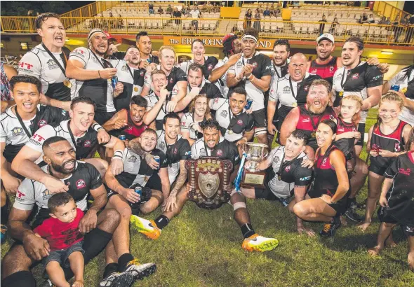  ?? Picture: GLENN CAMPBELL ?? Uni Pirates celebrate their victory over the Casuarina Cougars last night in the NTRU decider