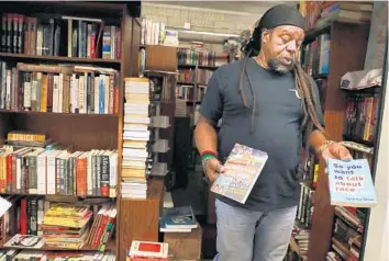  ?? CARLINE JEAN/SOUTH FLORIDA SUN SENTINEL ?? Akbar Watson, owner of Pyramid Books, has been inundated with requests from customers since the death of George Floyd.