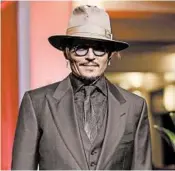  ?? ANDREAS RENTZ/GETTY ?? Johnny Depp, seen on Feb. 21, is suing British tabloid The Sun for libel over a 2018 article about him and his ex-wife.