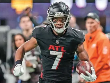  ?? AP PHOTO/MIKE STEWART ?? Atlanta Falcons running back Bijan Robinson runs the ball during the second half of the Dec. 10 game against the Tampa Bay Buccaneers in Atlanta.