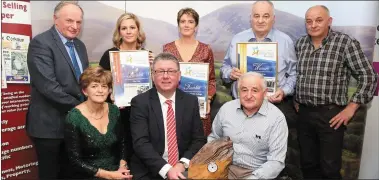  ??  ?? James McAuley of McCarthy Insurance presenting the Best Family Run Business Award to Catherine, Tadhg, Sean and Neil Kelly of Kelly Brothers. Also included are finalists Helena Corkery of Alucast and Michelle Horgan of Infinity English College.