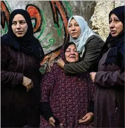  ?? FATIMA SHBAIR/AP ?? Palestinia­n women react to the damage after their home was hit by an airstrike in Rafah, southern Gaza Strip, on Thursday. Israel struck after Prime Minister Benjamin Netanyahu rejected Hamas’ cease-fire terms.