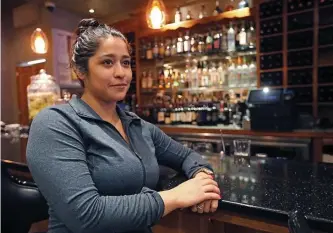  ?? MATT STONE / HERALD STAFF ?? OUT OF WORK: Cinthia Chavez, a bartender at Fiore restaurant in the North End, is going to be out of as job since the restaurant she works for is closing today because of the coronaviru­s outbreak.