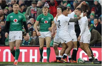  ??  ?? Hands up: Keith Earls walks away as England celebrate their opening try AP IMAGES