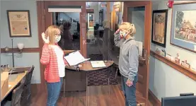  ?? M.E. JONES/ NVV ?? Karen Hill, right, is sworn in by Town Clerk Kathy Spofford for another three-year term on the Townsend Conservati­on Commission.