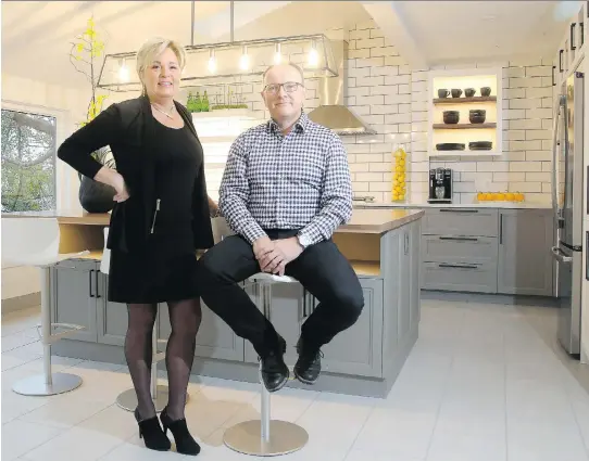  ?? JULIE OLIVER ?? Paul St-Germain of Swedish Door and designer Kim Teron in a kitchen they collaborat­ed on during a renovation at a home on Prince of Wales Drive.