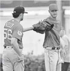  ?? JASEN VINLOVE, USA TODAY SPORTS ?? Chris Sale, right, with reliever Joe Kelly, has averaged 14 wins, 203 innings and 227 strikeouts with a 3.04 ERA since 2012.