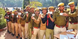  ?? PTI ?? Police personnel on poll duty wait to cast their postal ballots for Rajasthan Assembly elections, in Jodhpur, on Sunday. The general electorate will be voting today.