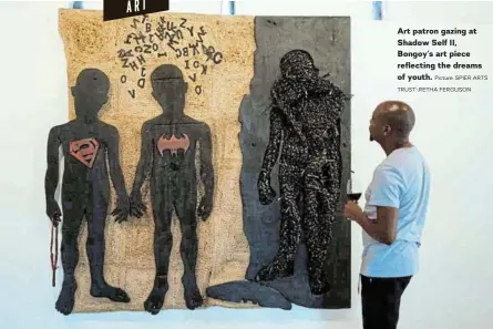  ?? Picture: SPIER ARTS TRUST\RETHA FERGUSON ?? Art patron gazing at Shadow Self II, Bongoy's art piece reflecting the dreams of youth.