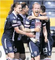  ??  ?? Man in form: Ross County attacker Liam Boyce, centre, after scoring in the 2-1 win at Kilmarnock