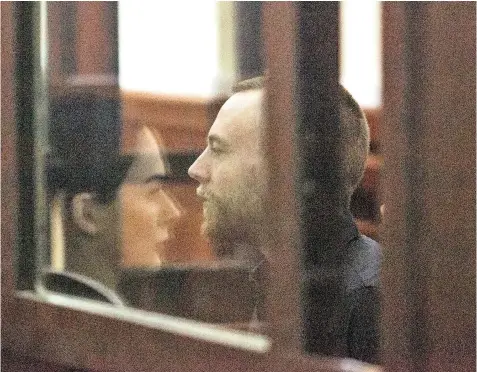  ??  ?? Jack Shepherd’s lawyer Mariam Kublashvil­i is seen reflected as he appears in court yesterday. Ms Kublashvil­i set out a list of demands to ‘ensure his safety’, but these were rejected