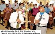  ??  ?? Vice Chancellor Prof. S.A. Ariadura and Deputy Vice Chancellor lighting the oil lamp