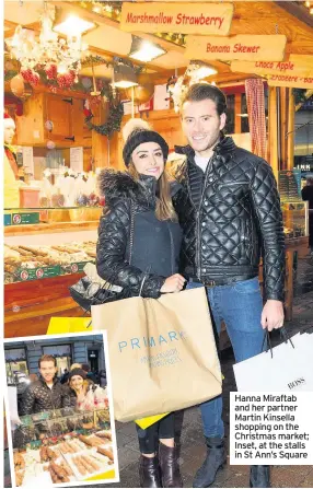  ??  ?? Hanna Miraftab and her partner Martin Kinsella shopping on the Christmas market; Inset, at the stalls in St Ann’s Square