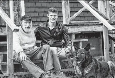  ?? SUBMITTED PHOTO/PURINA ANIMAL HALL OF FAME ?? Lloyd Stone, from left, Calvin Kuchta and his dog Arik pose for a photo. Kuchta and Arik, a former police dog, rescued Stone in the woods near Baddeck after the senior fell and broke his hip while cross-country skiing in March 2017. Arik was inducted...