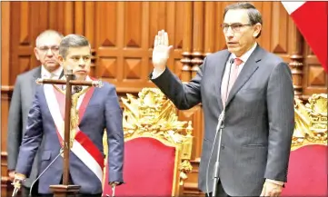  ??  ?? Vizcarra is sworn in as Peru’s president at the Congress building in Lima, Peru. — Reuters photo