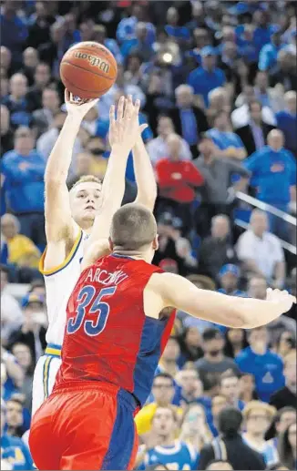  ?? Robert Gauthier Los Angeles Times
By Zach Helfand ?? BRYCE ALFORD TAKES the winning three-point shot over Arizona’s Kaleb Tarczewski in the final seconds at Pauley Pavilion. Alford also made a three-pointer just before the buzzer at halftime.
