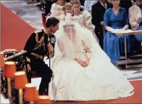  ?? AP PHOTO/ ?? This is a July 29, 1981, file photo of Prince Charles as he speaks with Princess of Wales during their wedding ceremony in St. Paul’s Cathedral in London. Thirty-six years after Lady Diana Spencer married Prince Charles, The Associated Press has restored original footage from the wedding and is making it available to the public on Youtube.