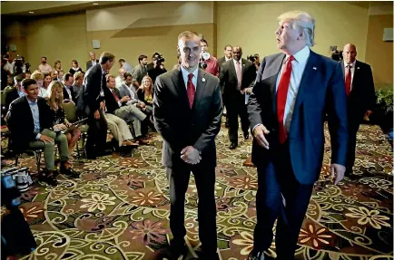  ?? PHOTO: AP ?? Corey Lewandowsk­i, seen with then Republican presidenti­al candidate Donald Trump, has written a tell-all book on their time working together.