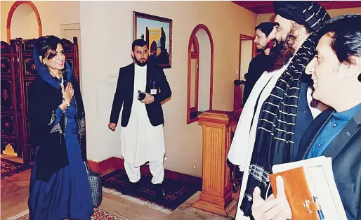  ?? ?? Pakistan’s Minister of State for Foreign Affairs Hina Rabbani Khar (left) speaking with Afghanista­n’s Foreign Minister Amir Khan Muttaqi (second right) during her visit in Kabul. — afp