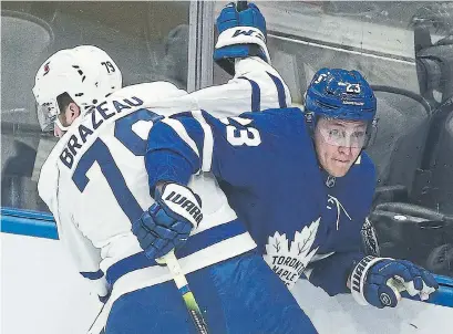  ?? STEVE RUSSELL TORONTO STAR ?? Travis Dermott, right, has areas of his game he has to work on but he’ll start the season on the Leafs’ main roster.