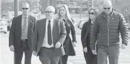  ?? ANDREW VAUGHAN, CP ?? Widows Rachel Ross, centre, and Nadine Larche, second from right, arrive at court in Moncton, N.B. Their husbands, constables Dave Ross and Doug Larche, were killed by gunman Justin Bourque in Moncton in 2014.