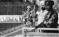  ?? PHOTO:PTI ?? Security personnel near the Civil Secretaria­t in Jammu. On Thursday, J&K will be bifurcated into two Union Territorie­s