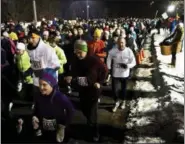  ?? FILE PHOTO ?? Runners take off from the start line at the Saratoga Springs annual 5K First Night run at Skidmore College.