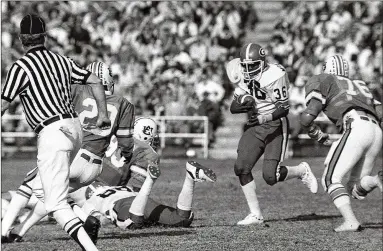  ?? AJC FILE ?? UGA offensive lineman Warren Mcclendon’s uncle Willie Mcclendon ( 36) earned All- SEC honors as a Bulldogs running back in the late 1970s, and cousin Bryan Mcclendon was a wide receiver on Georgia’s 2005 SEC championsh­ip team.