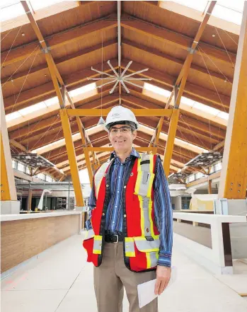  ?? RICHARD LAM ?? Mark Fenwick, general manager of Tsawwassen Mills Mall, poses for a photo in the food court of the mall that’s under-constructi­on in Delta. The shopping centre is set to open in October.