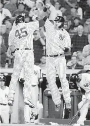  ?? FRANK FRANKLIN II/ASSOCIATED PRESS ?? Luke Voit, left, celebrates with Yankees teammate Gary Sanchez after Voit hit a two-run home run.