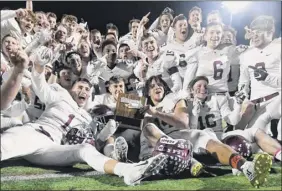  ?? Hans Pennink / Special to the Times Union ?? Burnt Hills players celebrate winning their Section II title in the Class A Super Bowl, played Saturday at Shenendeho­wa High School.