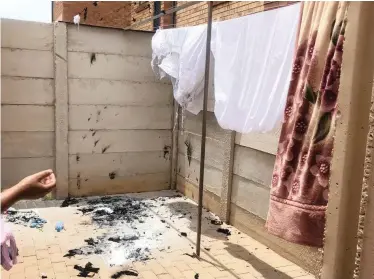  ??  ?? AMANDA Ngubombini reached an impasse with her neighbours after two boys set fire to the washing line – filled with laundry – in December. Her white linen and new outfits were destroyed.