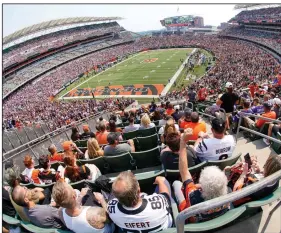  ?? (AP/Keith Srakocic) ?? Fans start to cheer before the start of the Minnesota Vikings-Cincinnati Bengals game Sunday afternoon at Paul Brown Stadium in Cincinnati. The NFL is allowing teams to have their stadiums at capacity for the first time since the coronaviru­s pandemic began in early 2020. More photos are available at arkansason­line.com/913nflweek­1/