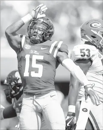  ?? JAMES PUGH / ASSOCIATED PRESS ?? Ole Miss freshman defensive back Myles Hartsfield celebrates after a tackle against Georgia during the first half Saturday in Oxford, Miss. The Rebels won the SEC matchup against the Bulldogs 45-14.