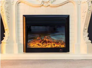  ?? Adobestock ?? An electric insert is one option when you want the look of a fireplace.