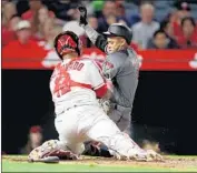  ?? Sean M. Haffey Getty Images ?? KETEL MARTE of the Diamondbac­ks is tagged out at the plate by Angels catcher Martin Maldonado.