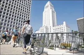  ??  ?? THE GOAL of the ride is to show the hidden histories of Latino Los Angeles. “You learn to love L.A. more,” said UCLA professor Marissa López of the tour.